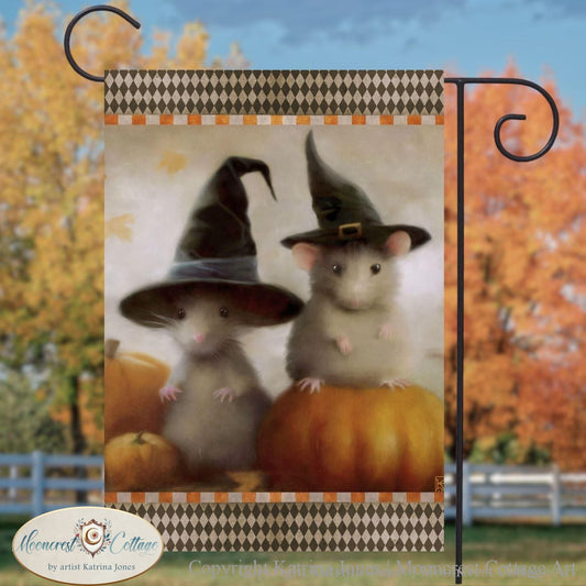 a picture of two mice dressed up as witches