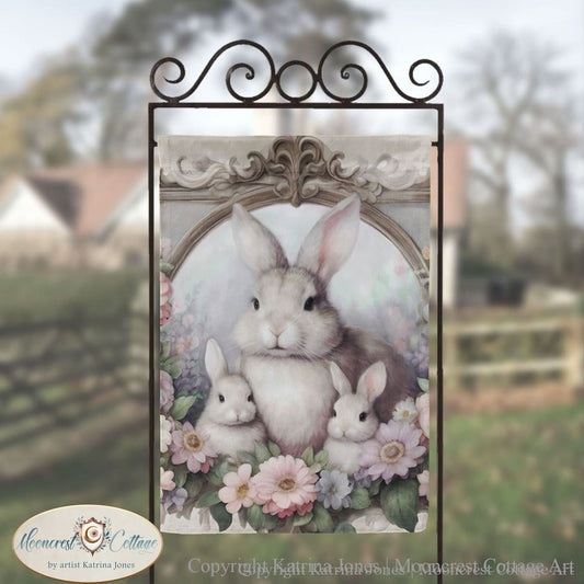 a picture frame with a picture of a bunny and two rabbits