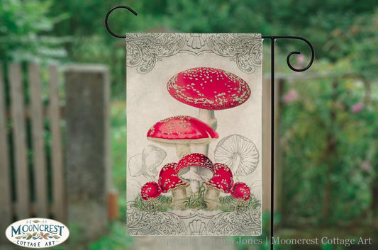 a garden flag with a picture of a mushroom on it